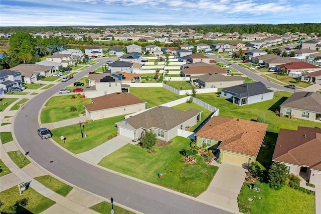 birds eye view of property with a residential view