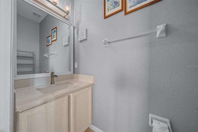 bathroom with visible vents and vanity