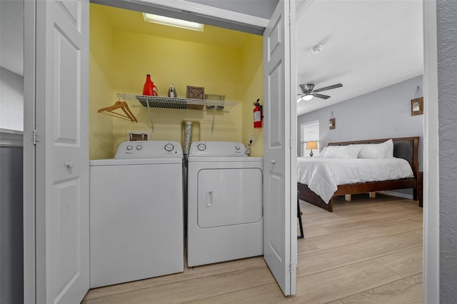 washroom with washer and dryer, laundry area, light wood-style flooring, and a ceiling fan