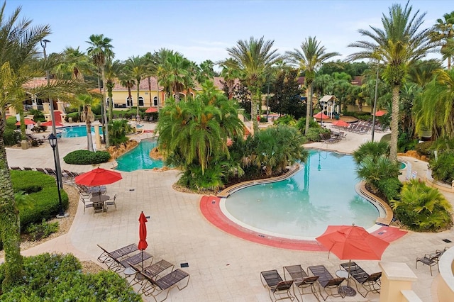 community pool with a patio area