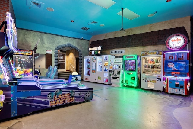 recreation room with finished concrete floors and visible vents