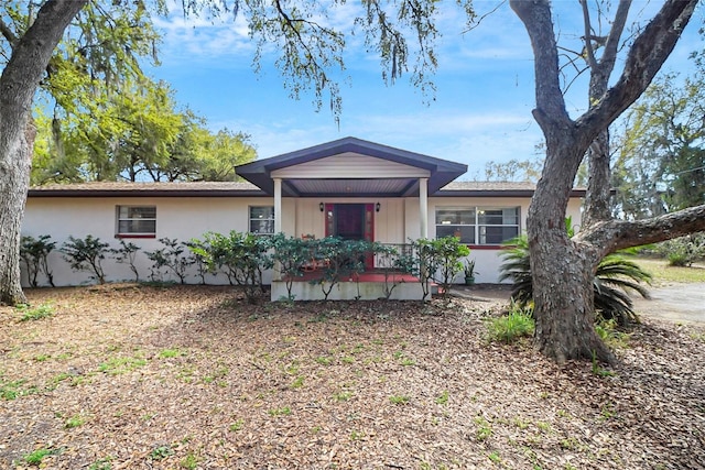 ranch-style house with stucco siding