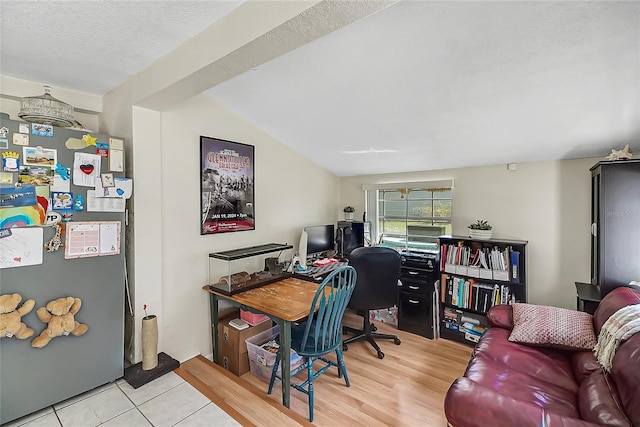 home office featuring a textured ceiling and wood finished floors