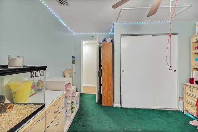 interior space featuring visible vents and ceiling fan