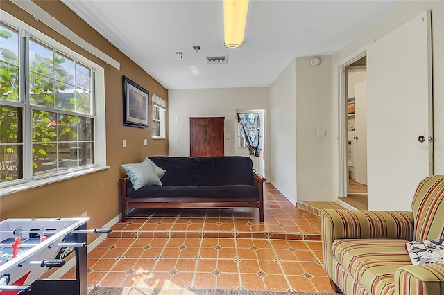 living room with visible vents and baseboards