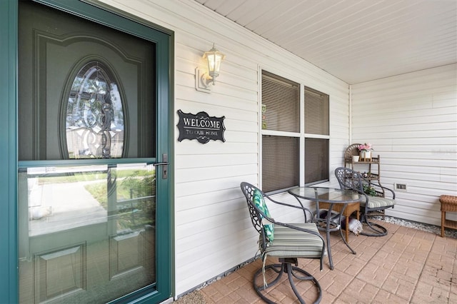 doorway to property with covered porch