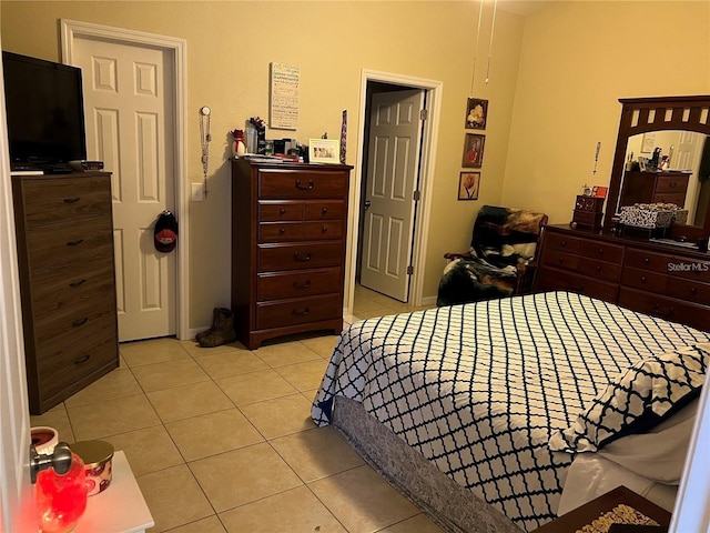 bedroom featuring light tile patterned flooring