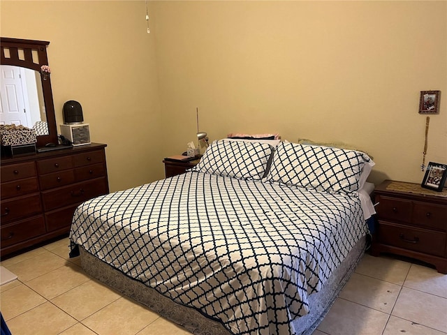 bedroom featuring light tile patterned flooring