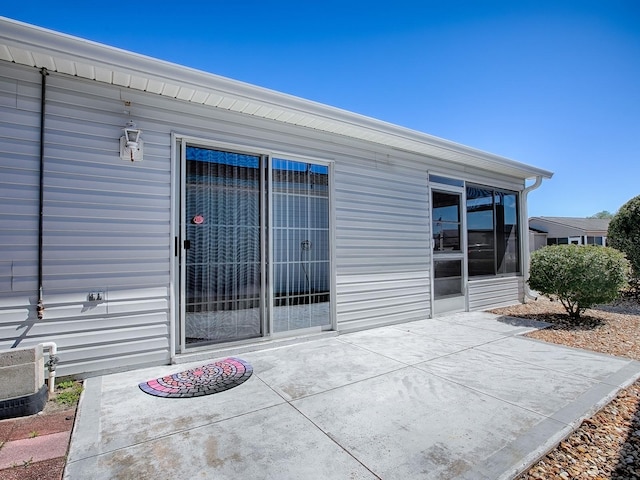 property entrance featuring a patio