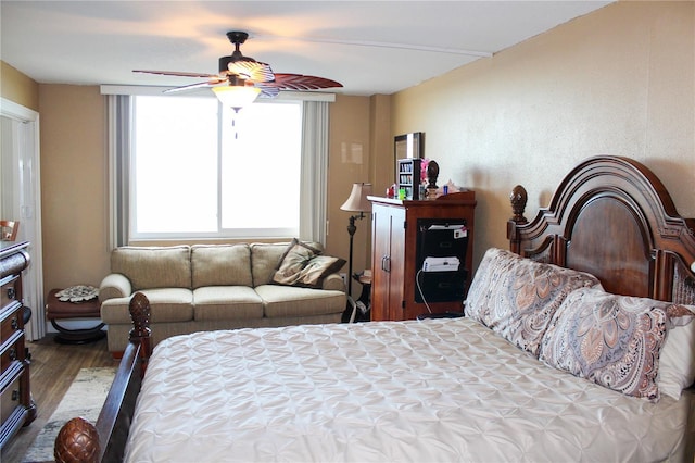 bedroom with wood finished floors and a ceiling fan