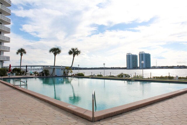 community pool with a water view