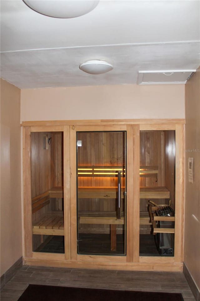 view of sauna with wood finished floors and baseboards