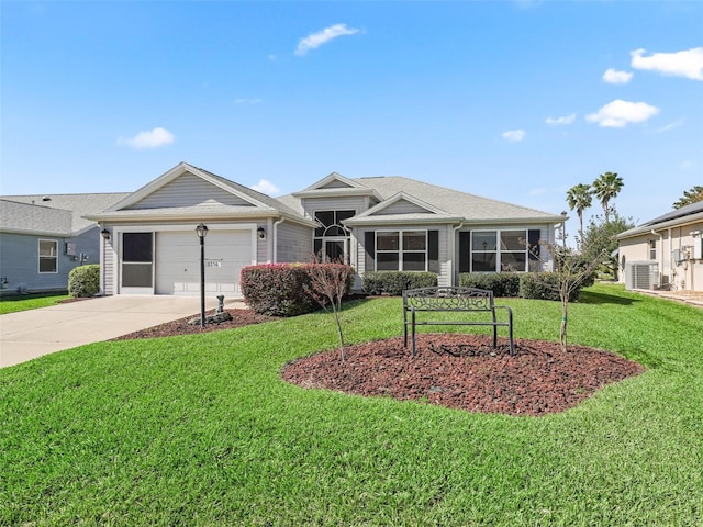 view of front of home featuring a front yard, concrete driveway, cooling unit, and an attached garage