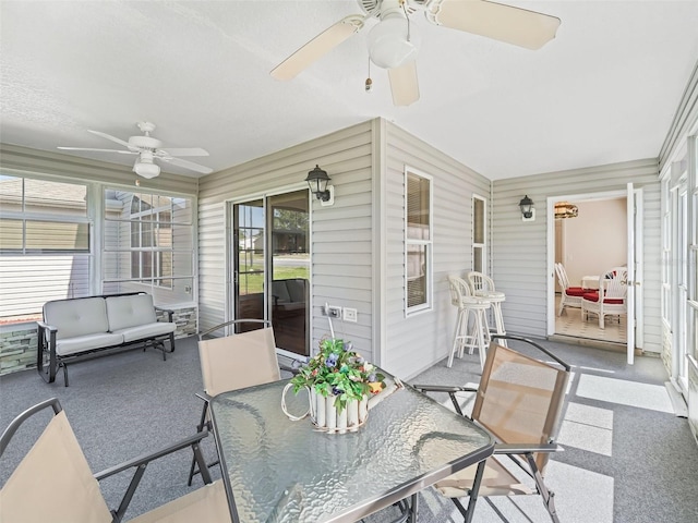 sunroom / solarium with ceiling fan