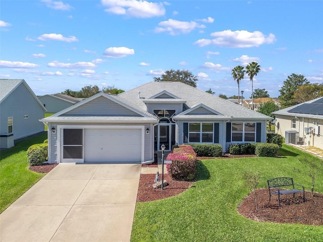 ranch-style house featuring a garage, central AC, concrete driveway, roof with shingles, and a front lawn