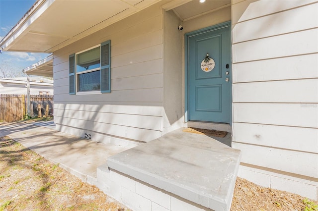 property entrance with fence