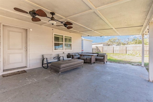 view of patio with ceiling fan, fence, and an outdoor hangout area