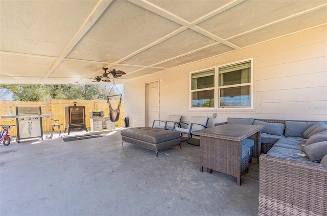 view of patio / terrace featuring grilling area, fence, and an outdoor living space