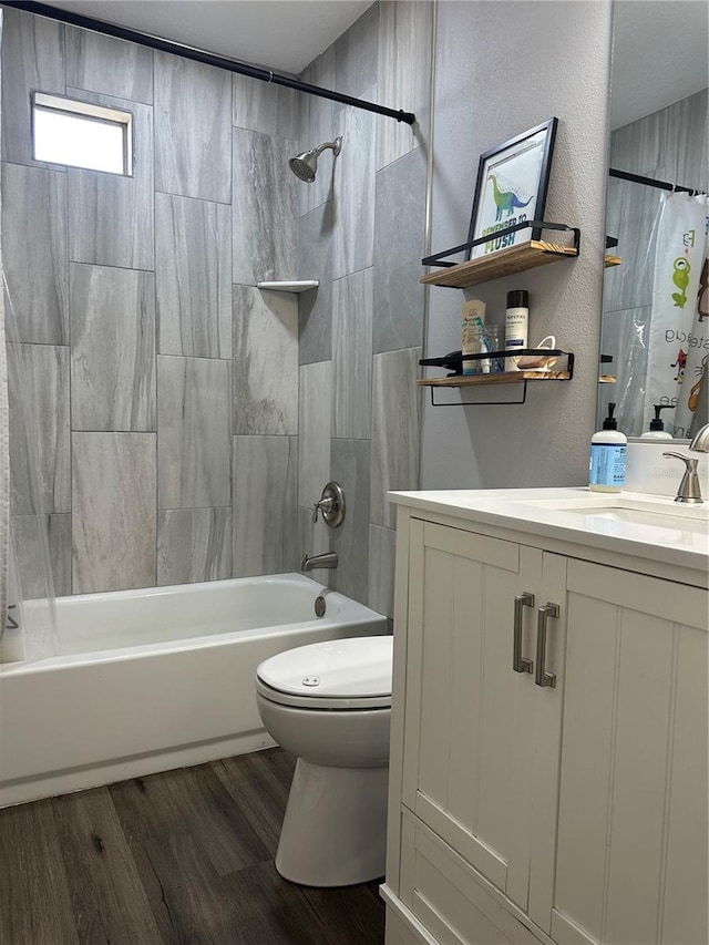 bathroom featuring vanity, shower / bath combo with shower curtain, wood finished floors, and toilet