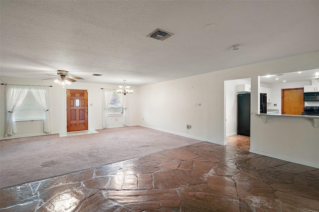 unfurnished living room with carpet floors, visible vents, a textured ceiling, baseboards, and ceiling fan with notable chandelier