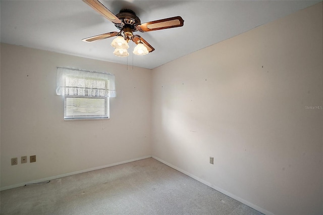 unfurnished room with ceiling fan, baseboards, and light colored carpet