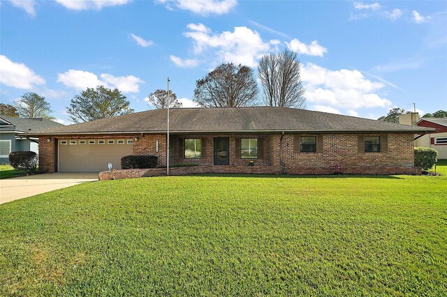 ranch-style home featuring a garage, driveway, brick siding, and a front yard