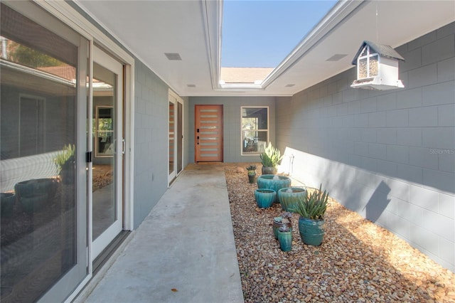 entrance to property with concrete block siding