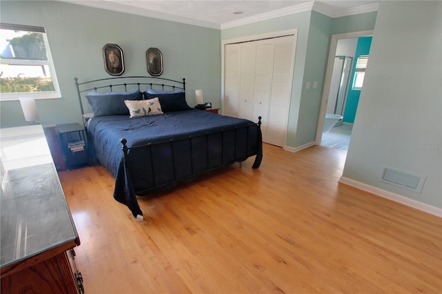 bedroom with ornamental molding, multiple windows, light wood-type flooring, and visible vents