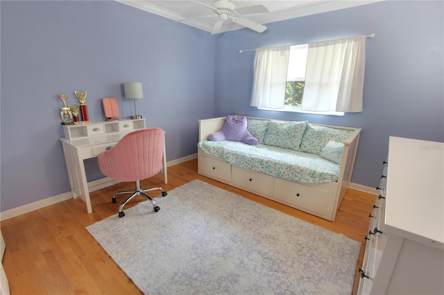 bedroom featuring ornamental molding, ceiling fan, light wood finished floors, and baseboards