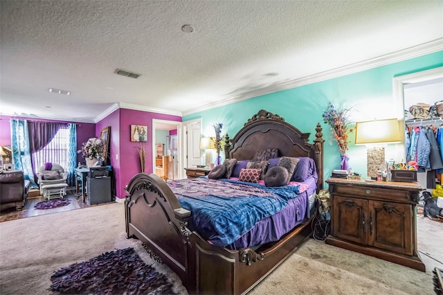 bedroom featuring crown molding, a textured ceiling, visible vents, and light colored carpet