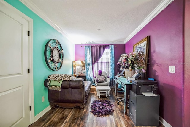 sitting room featuring a textured ceiling, baseboards, wood finished floors, and crown molding