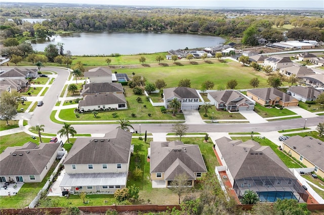 bird's eye view with a residential view and a water view