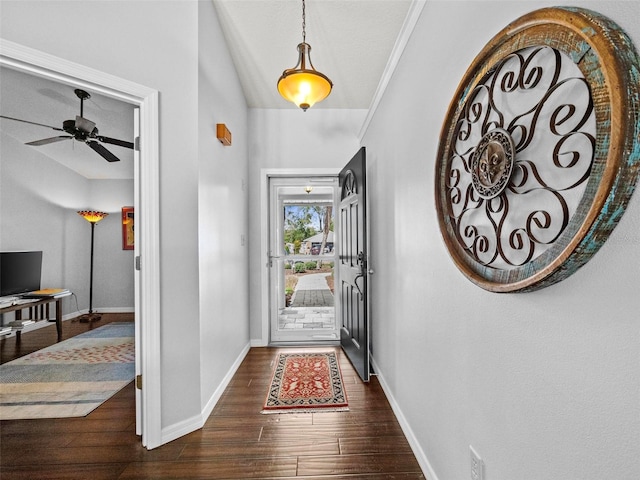 entryway with a ceiling fan, lofted ceiling, dark wood finished floors, and baseboards