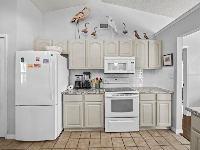 kitchen featuring white appliances, tasteful backsplash, visible vents, and light tile patterned flooring