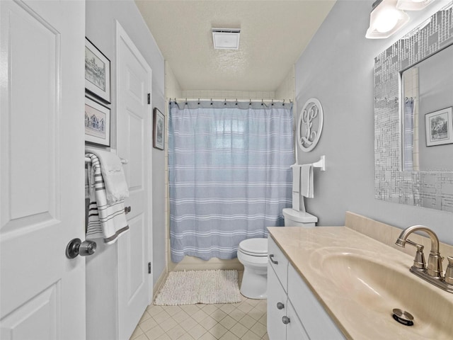 bathroom featuring a textured ceiling, tile patterned flooring, toilet, vanity, and a shower with curtain