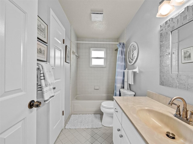 full bathroom with a textured ceiling, toilet, vanity, tile patterned floors, and shower / bath combination with curtain