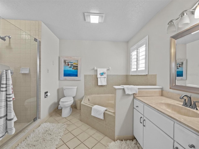 full bathroom featuring toilet, a stall shower, a textured ceiling, vanity, and a bath