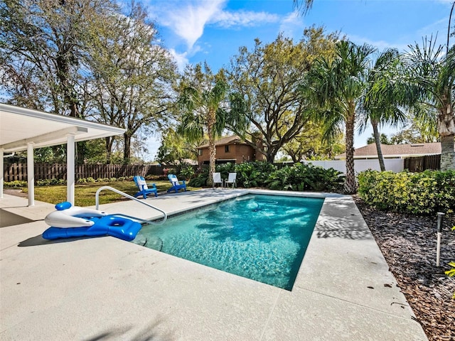 view of pool with a patio area, a fenced backyard, and a fenced in pool