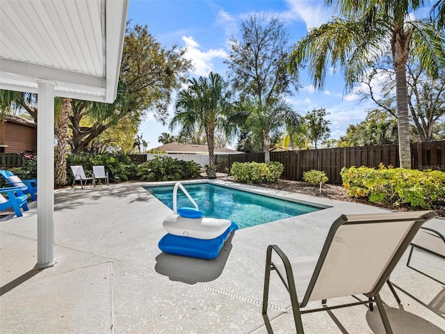 view of pool with a fenced backyard, a fenced in pool, and a patio