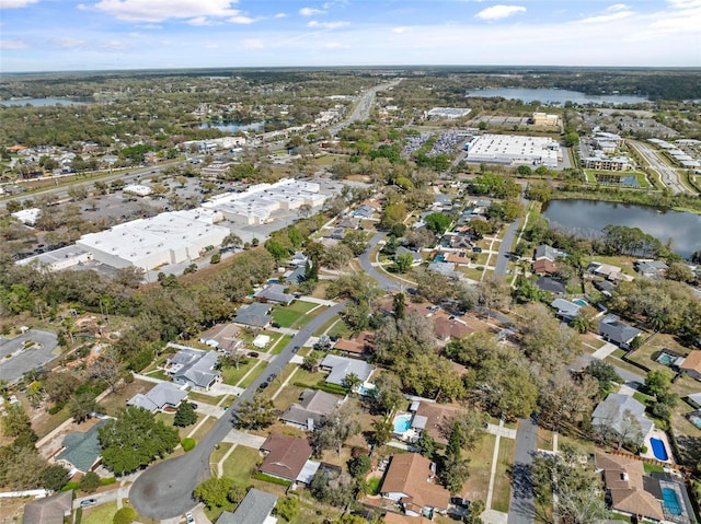 bird's eye view featuring a water view and a residential view