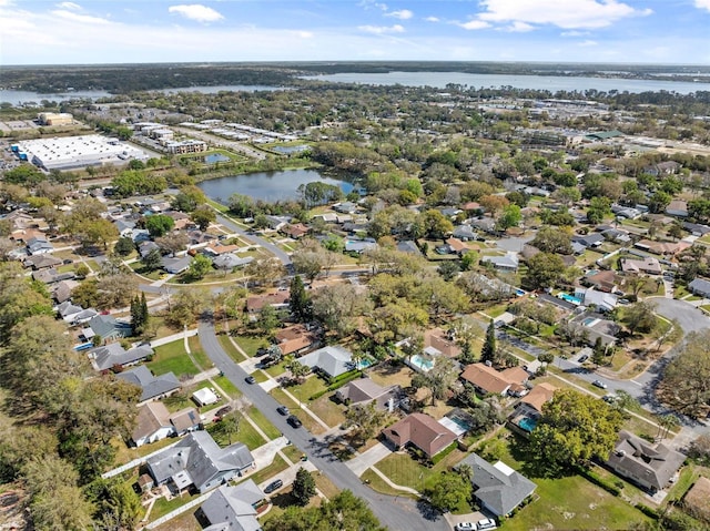 bird's eye view with a water view and a residential view