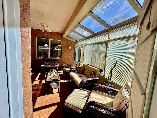 sunroom with vaulted ceiling with skylight and ceiling fan