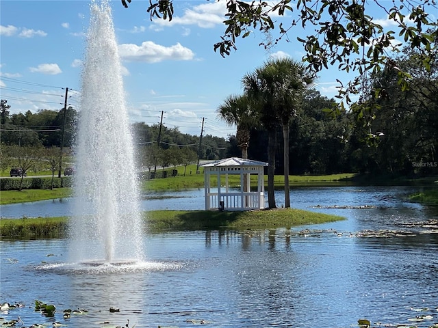 view of community with a gazebo and a water view