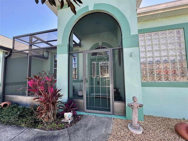 property entrance featuring stucco siding