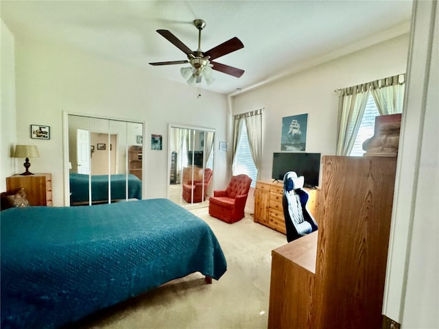 carpeted bedroom featuring ceiling fan