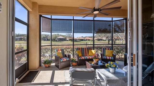 sunroom with a ceiling fan