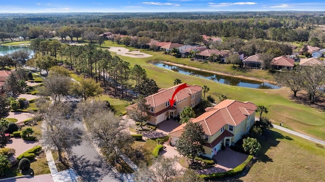 drone / aerial view featuring a water view and golf course view