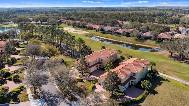 bird's eye view with a water view and golf course view