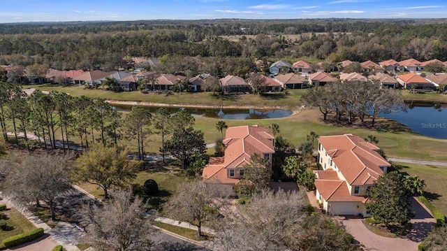 drone / aerial view featuring a residential view and a water view