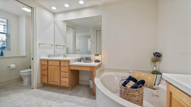 bathroom featuring toilet, recessed lighting, vanity, a bath, and tile patterned floors